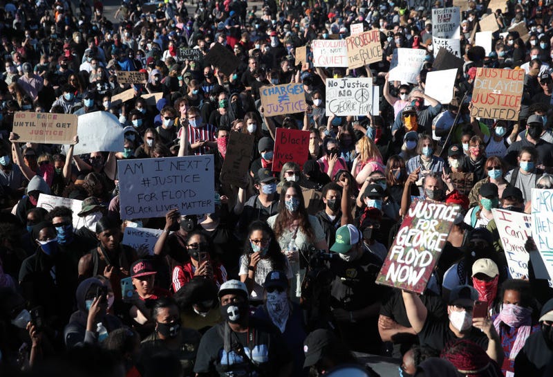 Demonstrators gather to protest the killing of George Floyd on May 30, 2020 in Minneapolis, Minnesota. Former Minneapolis police officer Derek Chauvin has been arrested and charged with third-degree murder and manslaughter after kneeling on Floyd's neck while detaining him as Floyd pleaded about not being able to breathe. Nationwide protests have erupted in response to George Floyd's death after a video of the arrest was circulated on social media.
