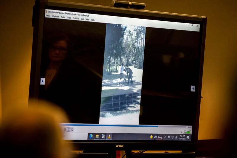 The prosecution plays a video the jury asked to see as part of their deliberation during the trial of Greg McMichel and his son, Travis McMichael, and a neighbor, William "Roddie" Bryan in the Glynn County Courthouse on November 24, 2021 in Brunswick, Georgia. Greg McMichael, his son Travis McMichael, and a neighbor, William "Roddie" Bryan are charged with the February, 2020 fatal shooting of 25-year-old Ahmaud Arbery. (Photo by Stephen B. Morton-Pool/Getty Images)