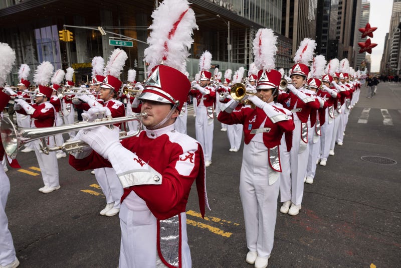 Brass band members play trumpets during the Macy's Thanksgiving Day Parade in New York City, New York on November 25, 2021