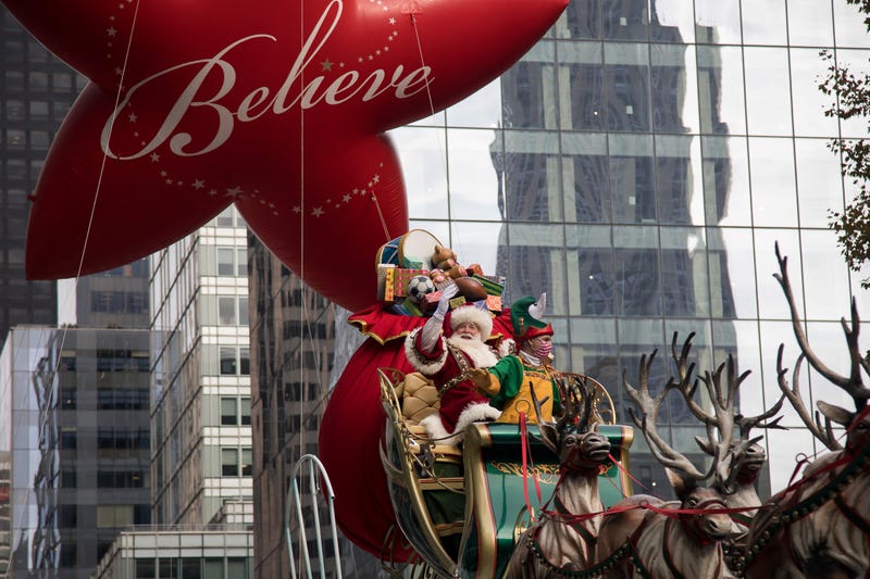 A performer dressed in Santa Claus costume rides on a float during the Macy's Thanksgiving Day Parade in New York, the United States, Nov. 25, 2021.