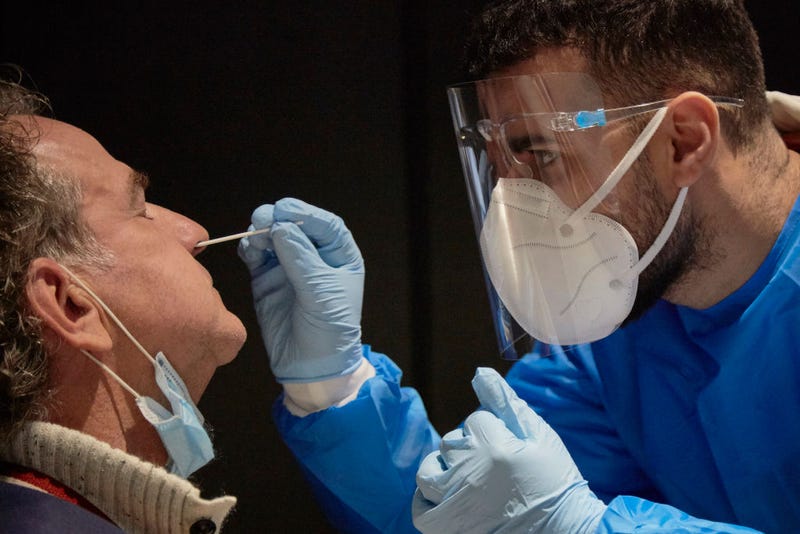 The passenger of a flight from South Africa is tested for the Coronavirus at Amsterdam Schiphol airport on December 2, 2021 in Amsterdam, Netherlands.