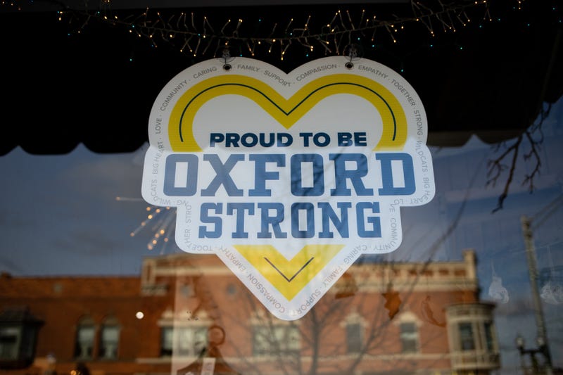 "Proud to be Oxford Strong" sign on heart in shop window