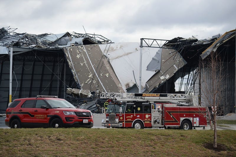 First responders surround a damaged Amazon Distribution Center on December 11, 2021 in Edwardsville, Illinois. According to reports, the Distribution Center was struck by a tornado Friday night.