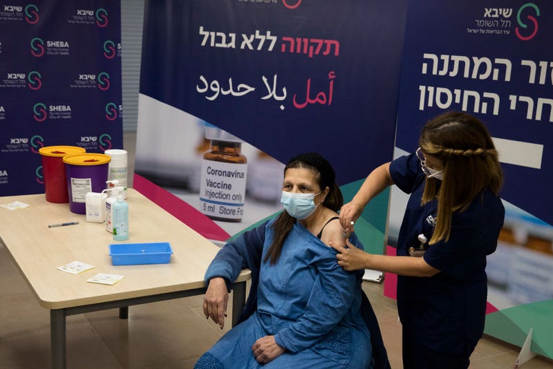 Heart transplant patient, Malka Pe'er receives a fourth dose of coronavirus (COVID-19) disease vaccine on December 31, 2021 in Ramat Gan, Israel. Israel's Health Ministry approves a fourth vaccine dose for people with compromised immune systems. (Photo by Amir Levy/Getty Images)