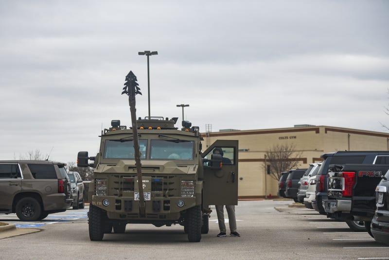 An armored truck is parked in the parking lot of Colleyville Middle School Texas. Police responded to a hostage situation at Beth Israel Congregation synagogue after reports of a man with a gun was holding hostages.