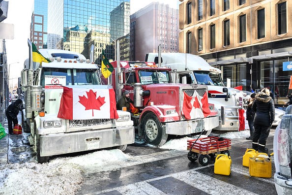 Truckers refuel their trucks in the cold during the Freedom Convoy truck protest on February 5, 2022 in Ottawa, Canada.
