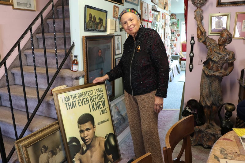 90-year-old retired teacher Elizabeth Meaders, poses for a photo as her house becomes a museum with a collection of more than 20 thousand pieces about black history in Staten Island on Feb. 10, 2022.