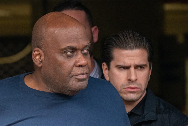 Suspect Frank James is escorted out of the 9th Precinct by police after being arrested for his connection to the mass shooting at the 36 St subway station on April 13, 2022.