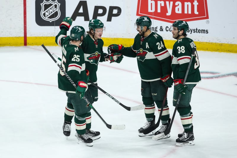 Kirill Kaprizov #97 of the Minnesota Wild celebrates scoring an empty net goal against the St. Louis Blues for a hat trick with teammates in the third period in Game Two of the First Round of the 2022 Stanley Cup Playoffs at Xcel Energy Center on May 4, 2022 in St Paul, Minnesota.