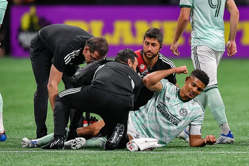 Atlanta defender Miles Robinson (12) reacts after injuring his leg during the MLS match between Chicago Fire and Atlanta United FC on May 7th, 2022 at Mercedes-Benz Stadium in Atlanta, GA.