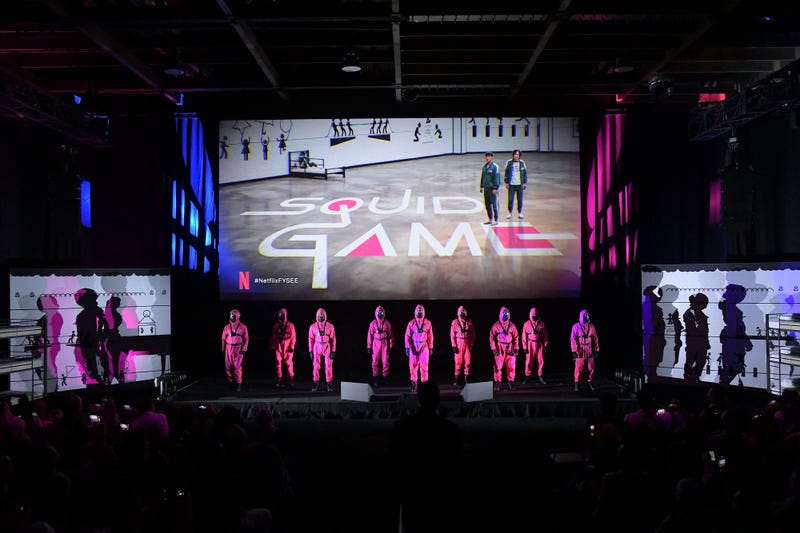 Squid Game guards appear onstage during Netflix's FYSEE event for "Squid Game" at Raleigh Studios Hollywood on June 12, 2022 in Los Angeles, California.