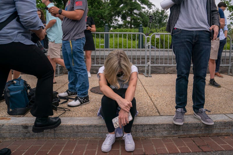 Abortion-rights activist Jamie McIntyre reacts to the 6-3 ruling in Dobbs v. Jackson Women's Health Organization which overturns the landmark abortion Roe v. Wade case in front of the Supreme Court on June 24, 2022 in Washington, DC.