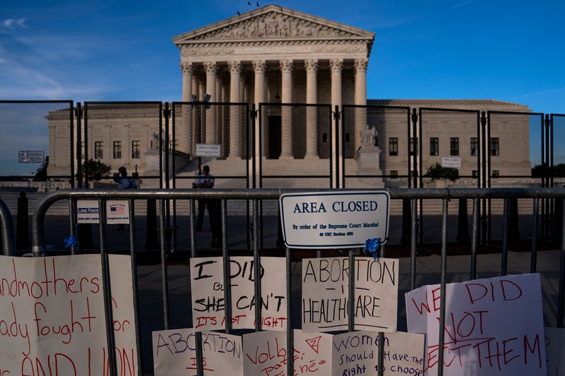Signs left by abortion-rights supporters line the security fence surrounding The Supreme Court on June 28, 2022 in Washington, DC. The Supreme Court's decision in Dobbs v Jackson Women's Health overturned the landmark 50-year-old Roe v Wade case and erased a federal right to an abortion.