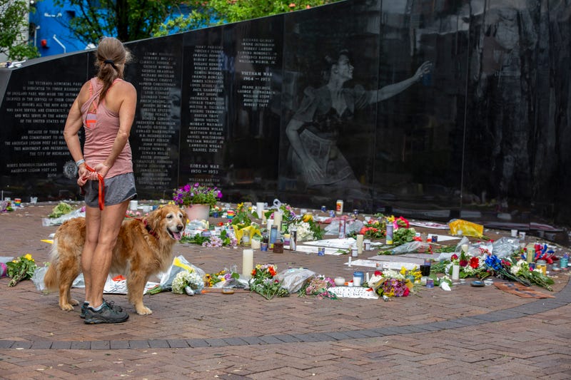 Woman at memorial after Highland Park Shooting