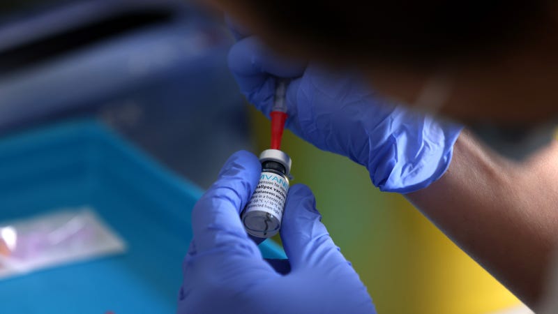 A medical professional prepares a dose of the monkeypox vaccine. Monkeypox, a rare disease, is part of the same family of viruses as smallpox.