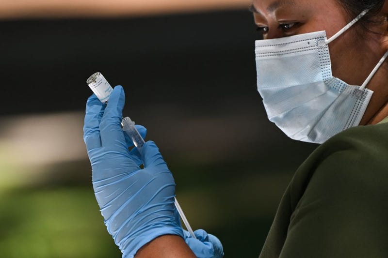 A health care worker prepares a dose of the JYNNEOS Monkeypox vaccine at a pop-up vaccination clinic in Los Angeles, on August 9, 2022.