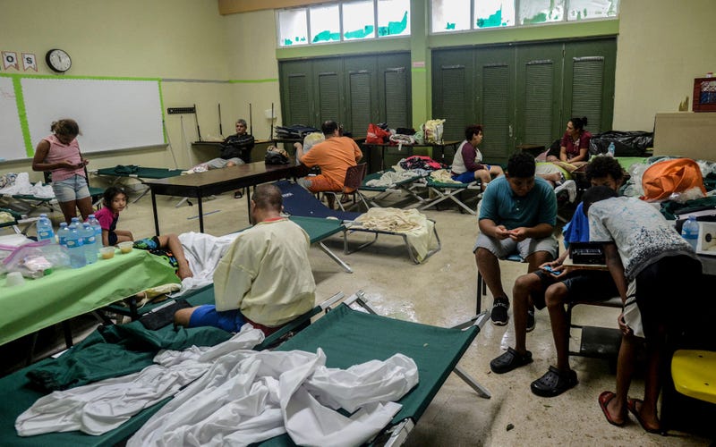 People await inside a shelter after the passage of hurricane Fiona in Salinas, Puerto Rico, on September 19, 2022.