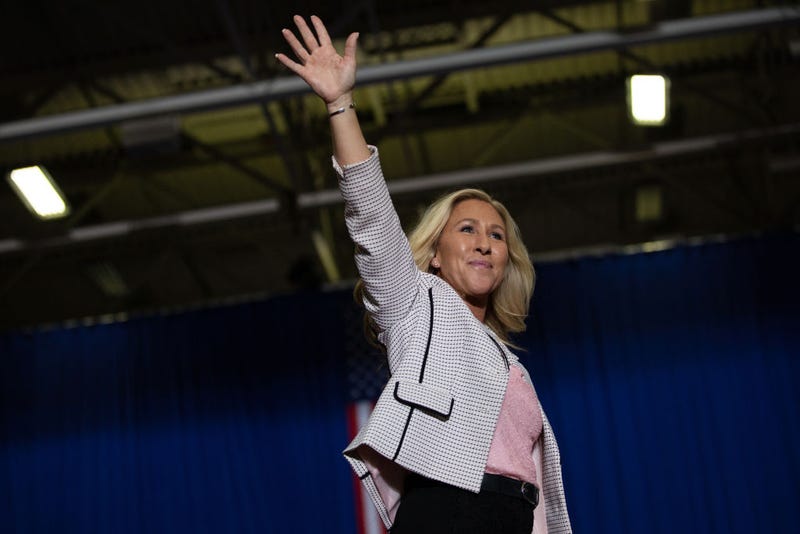Rep. Majorie Taylor Greene (R-GA) waves to the crowd before she makes speaks during a Save America rally on October 1, 2022 in Warren, Michigan.