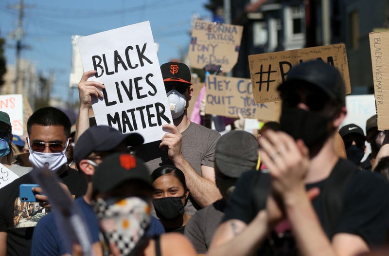 Protesters hold signs and chant during a demonstration to honor of George Floyd on June 03, 2020 in San Francisco, California.