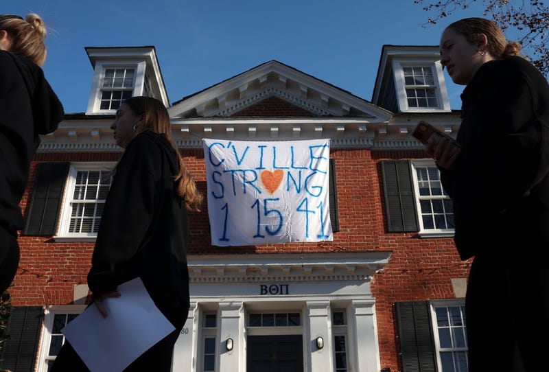 A banner honoring the three University of Virginia football players killed in Monday's (Nov. 14) shooting hangs from a fraternity house in Charlottesville, Va.