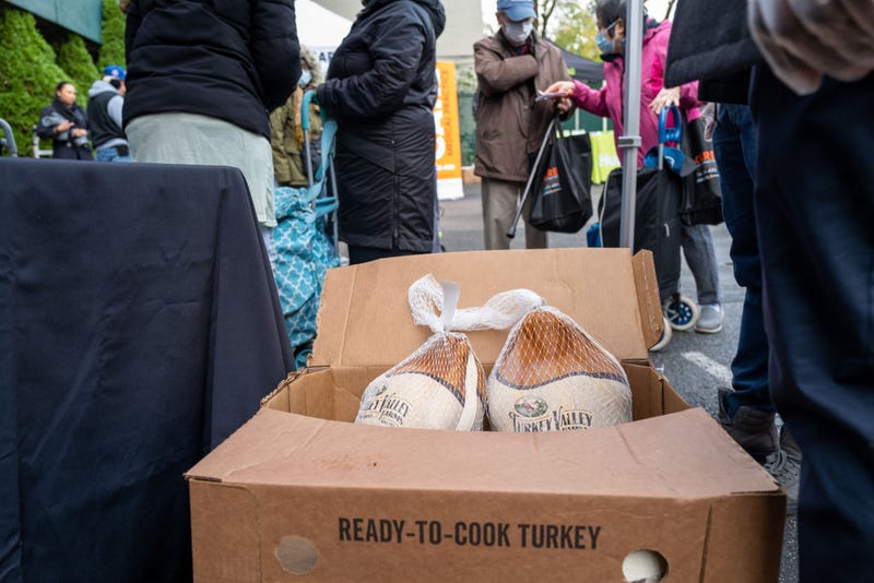 People receive free turkeys and other Thanksgiving oriented food at a community Thanksgiving food drive in Brooklyn to those in need on November 16, 2022 in New York City. The events, which was hosted by local politicians, businesses and charities, gave away over 1000 turkeys, chicken dinners and groceries. As food prices continue to rise across the country due to inflation, millions of Americans are struggling to afford groceries this holiday season.(Photo by Spencer Platt/Getty Images)