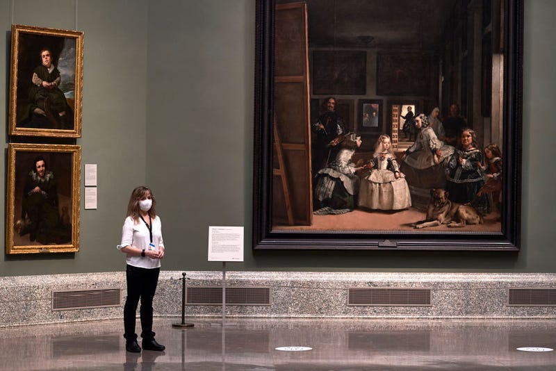 A museum worker wearing a face mask is seen next to Velazquez's 'Las Meninas' painting at the El Prado Museum during a press preview before its reopening to the public, during the coronavirus (COVID-19) pandemic on June 04, 2020 in Madrid, Spain. Spain has largely ended the lockdown it imposed to curb the spread of Covid-19, which caused the death of more than 27,000 people across the country.