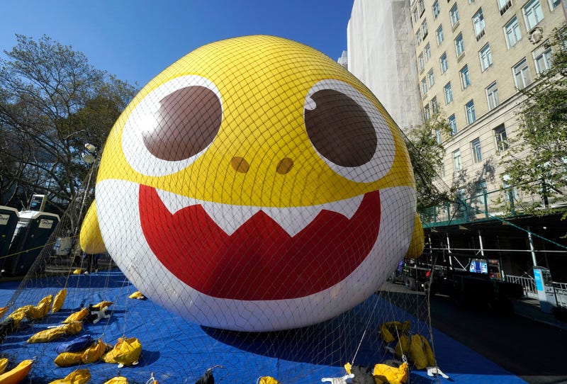 Members of the Macy's Inflation Team work to inflate the Baby Shark ballon, to be used in the upcoming 96th Macy's Thanksgiving Day Parade, in New York City on November 23, 2022.