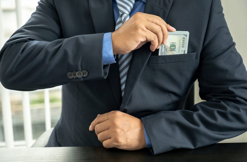 Guy Embezzling Money