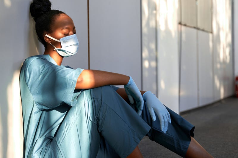 Exhausted nurse stock photo.