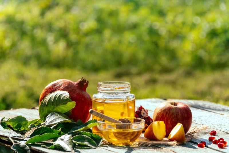 Apple and honey and pomegranate, traditional food of jewish New Year - Rosh Hashana