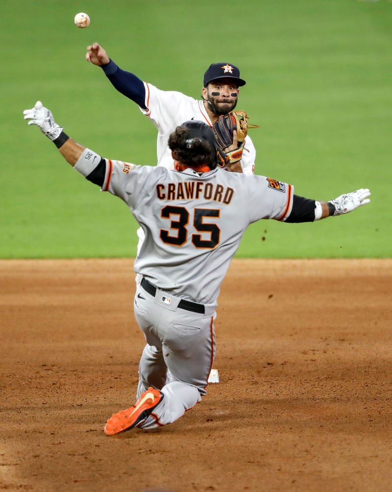 ose Altuve #27 of the Houston Astros forces Brandon Crawford #35 of the San Francisco Giants out at second and throws to first in the fifth inning at Minute Maid Park on August 11, 2020 in Houston