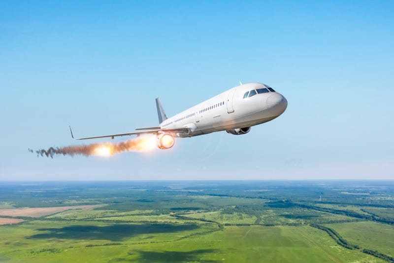 plane with engine on fire