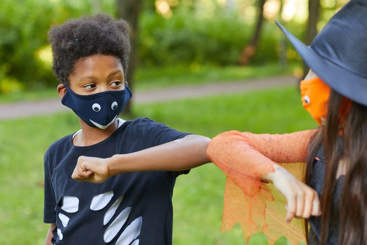 Two kids wearing masks
