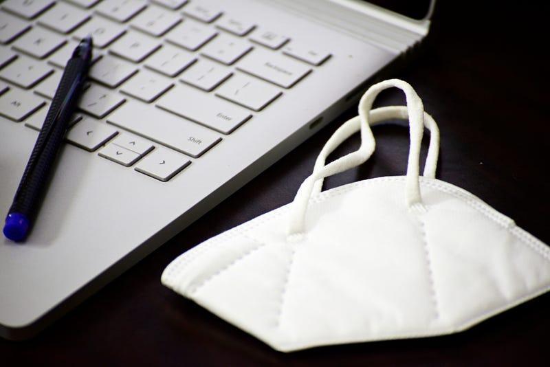 Mask on computer keyboard stock photo.