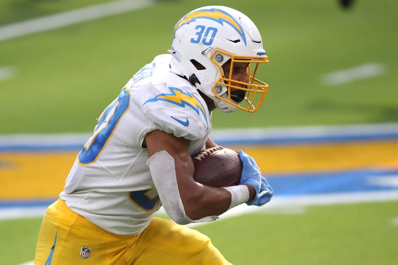 Chargers running back Austin Ekeler carries the ball.