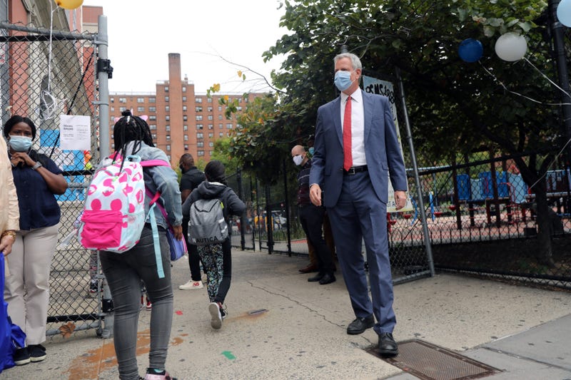 New York City Mayor Bill de Blasio stands at P.S. 188 as he welcomes elementary school students back to the city's public schools for in-person learning on September 29, 2020 in New York City.