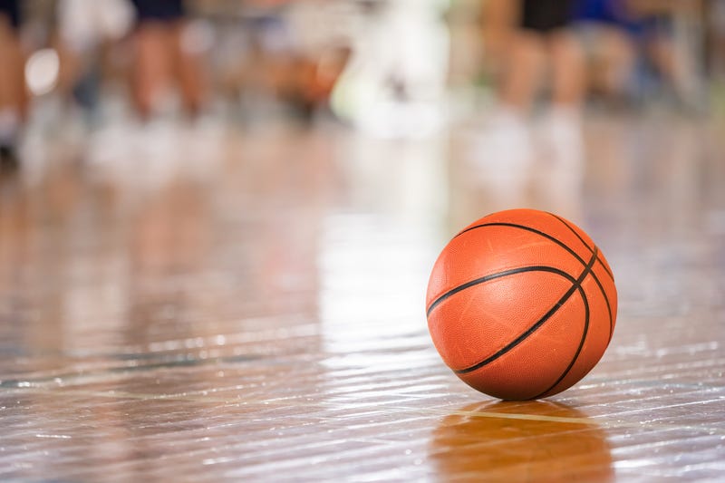 Basketball on court.