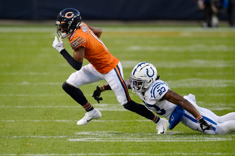 Darnell Mooney runs with the ball against the Colts.
