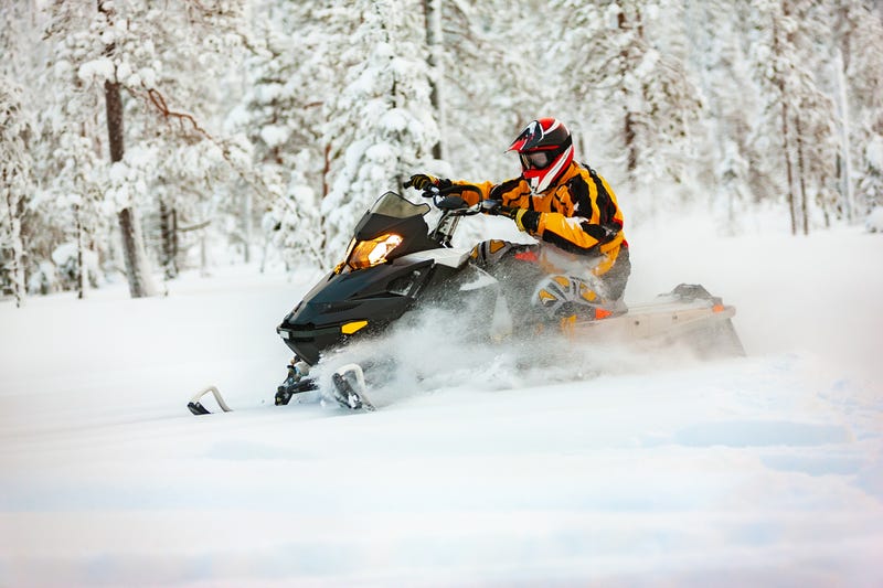 Man rides snowmobile