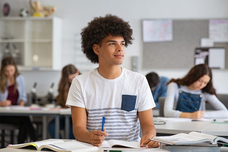 Guy thinking in class