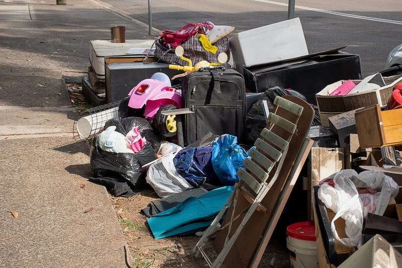 garbage on the side of a street