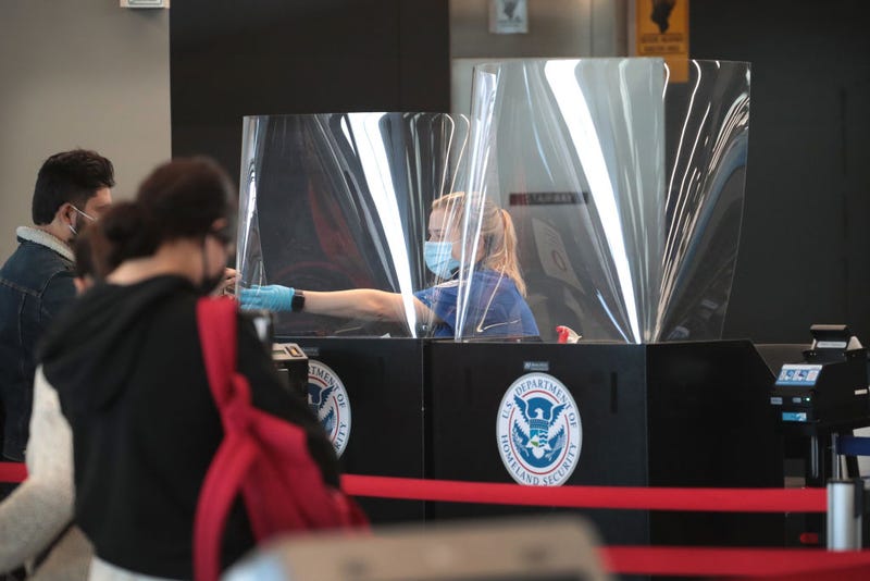 A Transportation Security Administration (TSA) agent screens an airline passenger at O'Hare International Airport on October 19, 2020 in Chicago, Illinois. Yesterday the TSA reported that it had screened over 1 million passengers, representing the highest number of passengers screened at TSA checkpoints since March 17, 2020. During the week ending October 18, TSA screened 6.1 million passengers nationwide, the highest total since the start of the COVID-19 pandemic. (Photo by Scott Olson/Getty Images)