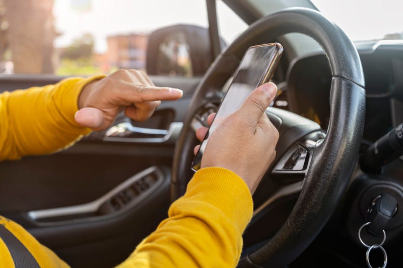 Driver using a phone.
