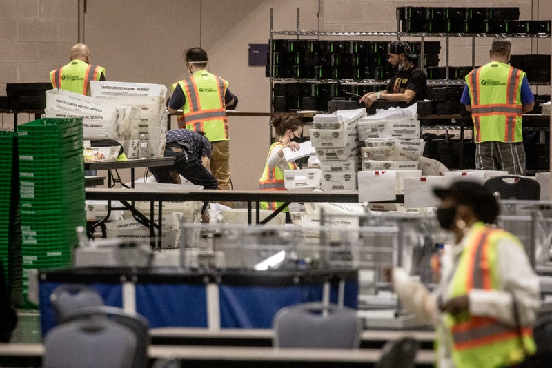 Votes continue to be counted at the Pennsylvania Convention Center in Philadelphia.