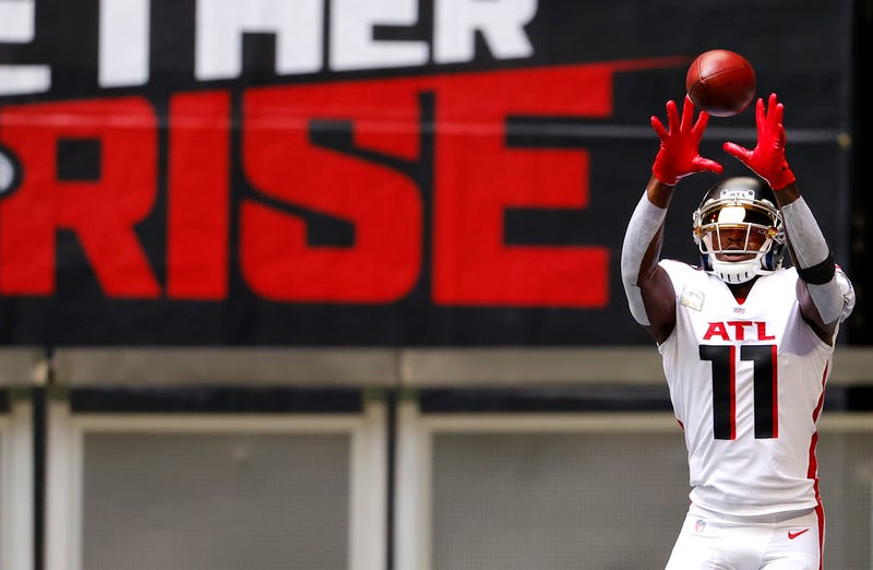 Falcons wide receiver catching a pass on the field.