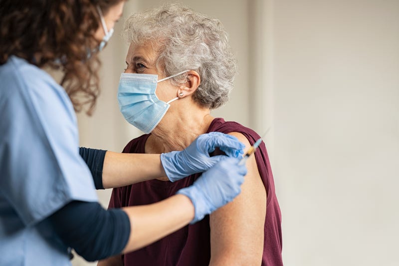 Nurse administering coronavirus vaccine
