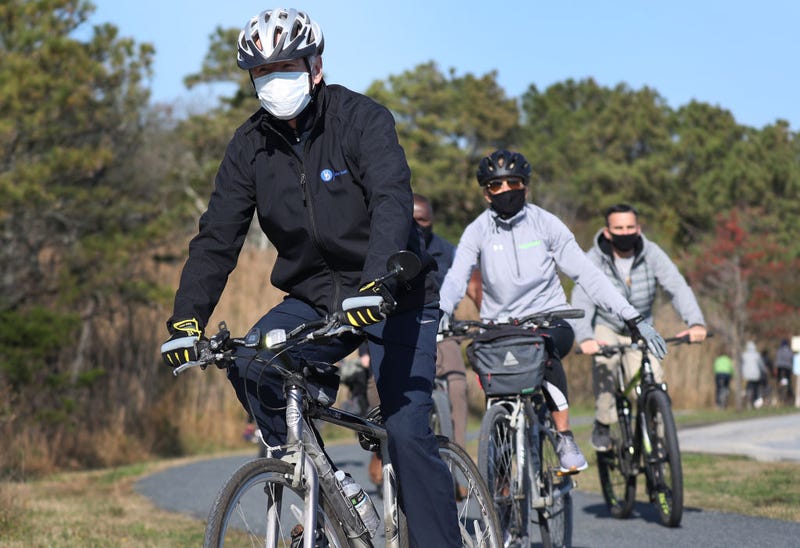 U.S. President Joe Biden and his wife Jill Biden take a bike ride through Cape Henlopen State Park on November 14, 2020 in Lewes, Delaware.
