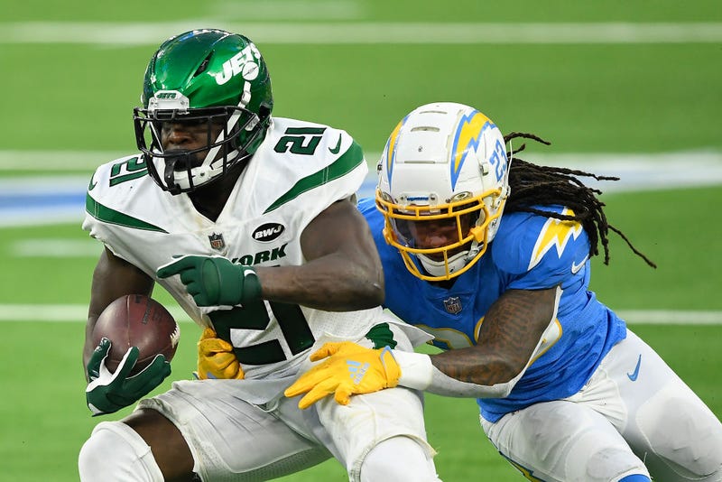 Frank Gore attempts to break a tackle of a Chargers defender.
