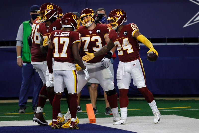 The Washington Football Team celebrates a touchdown against the Cowboys.