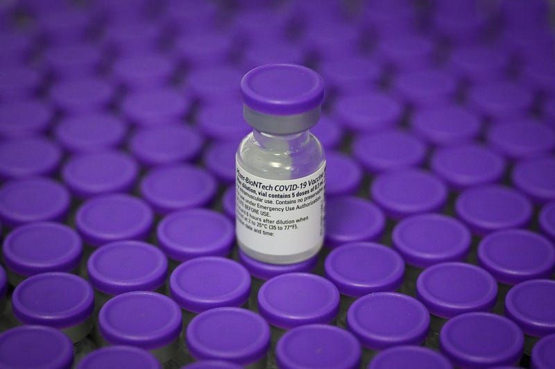 Vials of the Pfizer/BioNTech Covid-19 vaccine are seen during a vaccination clinic at the Sir Ludwig Guttmann Health and Wellbeing Centre on December 15, 2020 in Stratford, England.